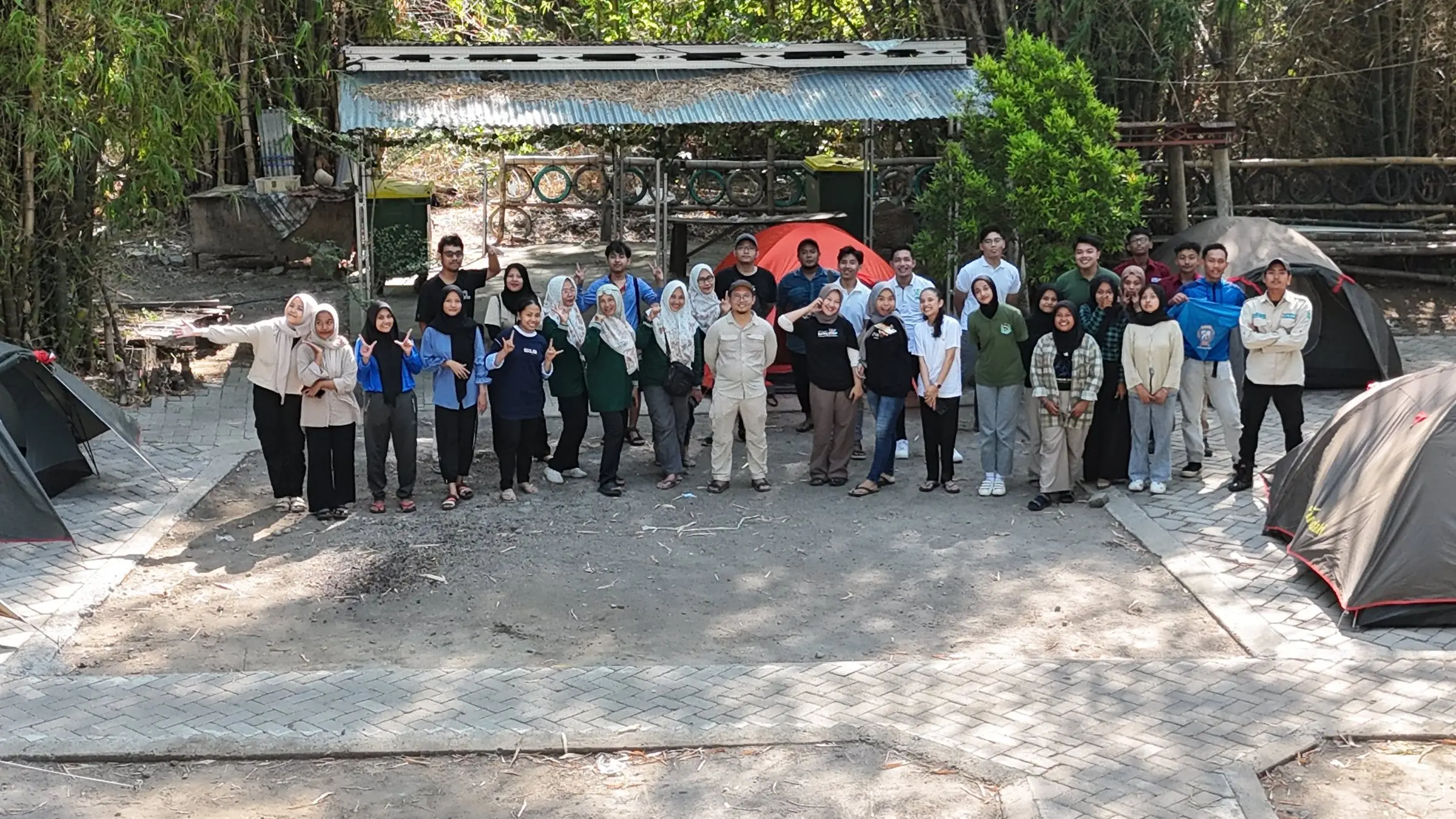Camp participants together on the camping ground among the tents