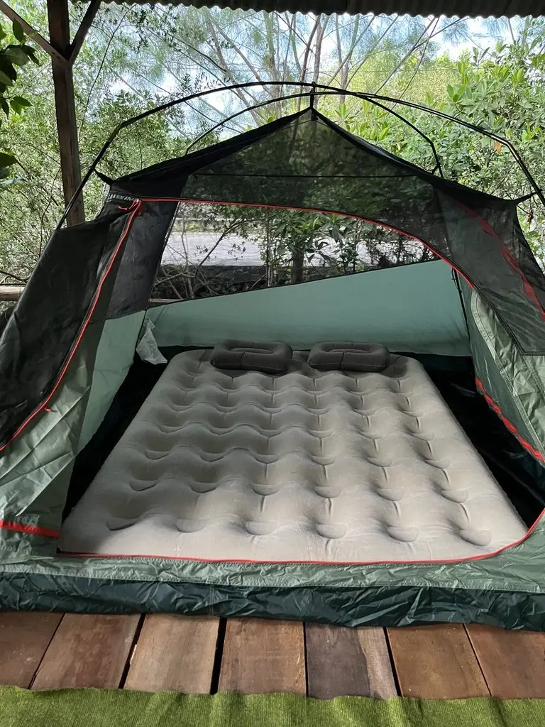 A tent with an air mattress at the camping ground
